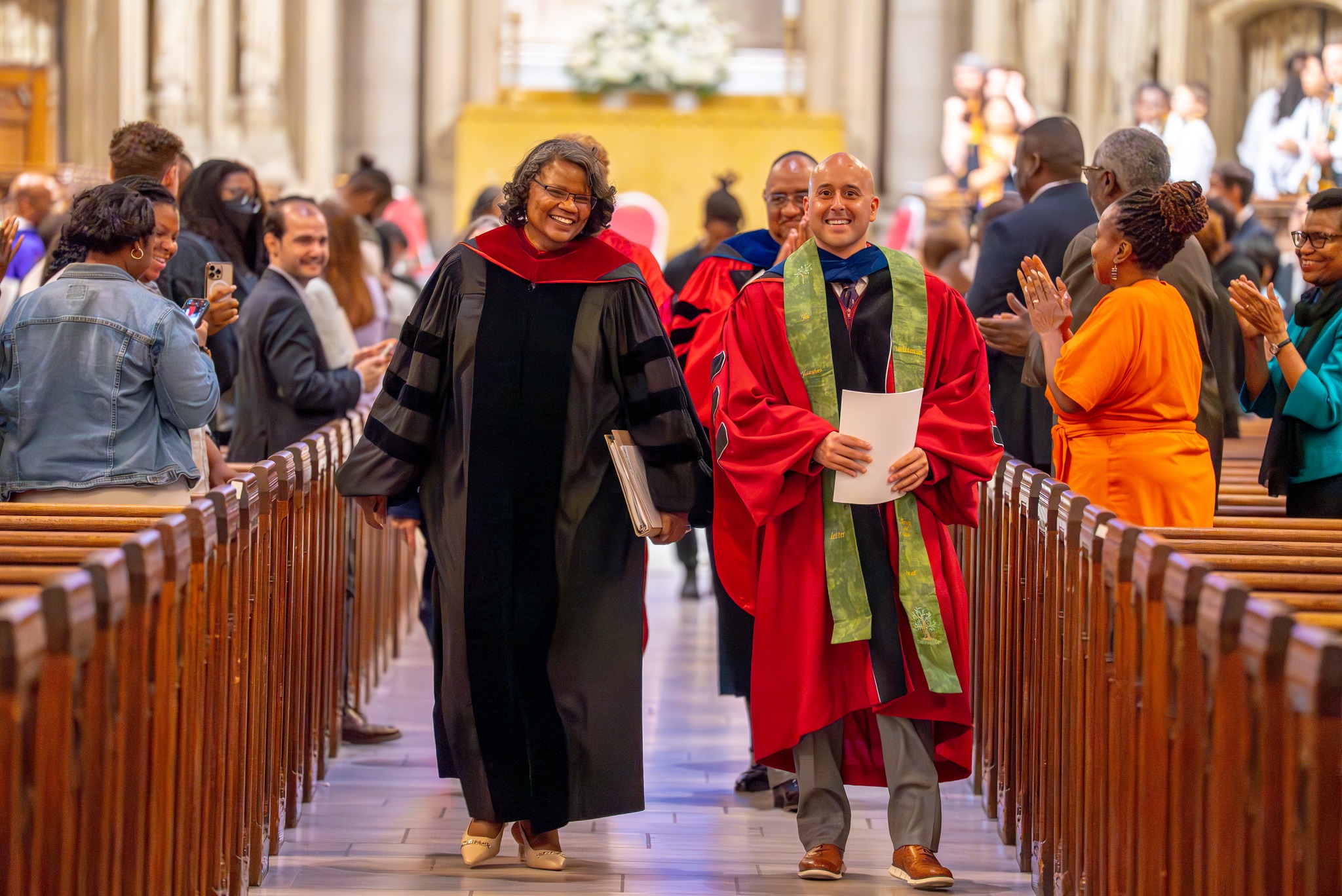 People walking down aisle at a church